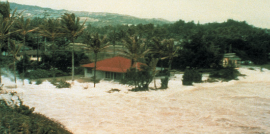 A tsunami floods houses in Oahu Hawaii in 1957 What causes tsunamis - photo 2