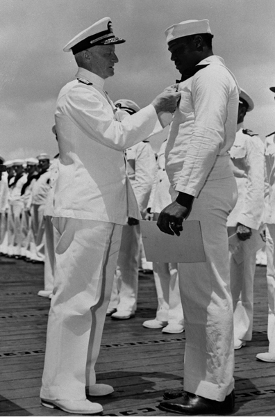 Admiral Chester Nimitz pins the Navy Cross on Dorie Miller May 27 1942 And - photo 3