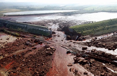 An aerial photo taken on Oct 8 2010 shows a reservoir of red sludge pouring - photo 9