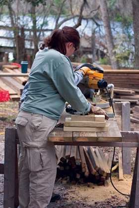 Image Credit Ralph125iStockphotocom A teen volunteer saws planks for a - photo 4