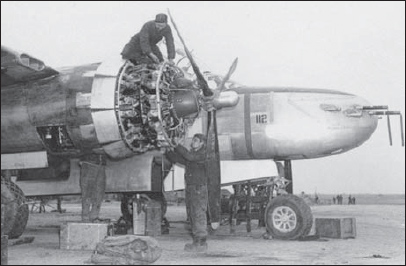 Nacelles removed an early-build A-26B receives routine maintenance in the open - photo 4