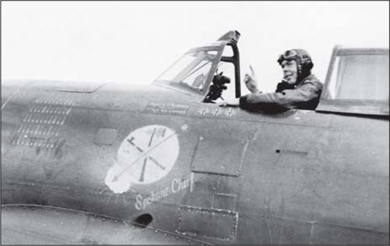 Maj Eugene Roberts CO of the 84th FS gestures to the press from the cockpit - photo 4