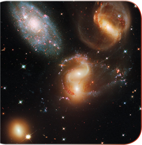 Stephans Quintet a group of galaxies with stars of many ages and colors as - photo 10