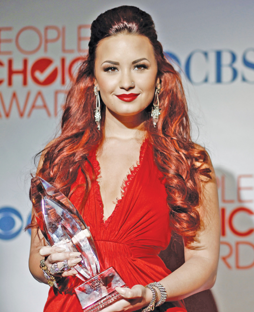 Image Credit Matt Sayles Demi Lovato poses backstage with her award for - photo 2