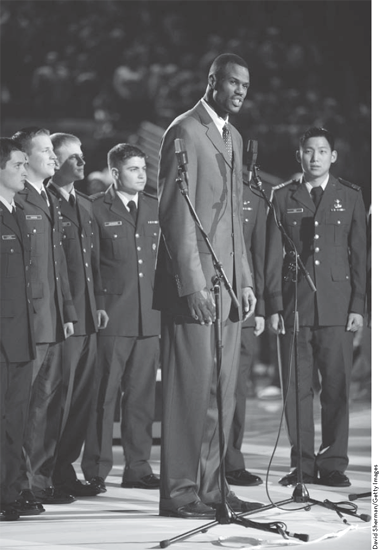 David Robinson stands well above his colleagues at seven feet tall as he - photo 3