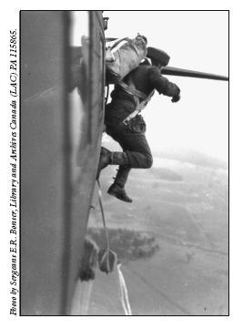 A Canadian paratrooper exiting a Douglas C-47 Dakota during a training jump in - photo 7