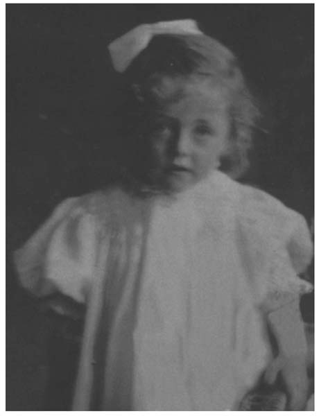 Little Ida with her special ribbon in her hair all dressed up ready to go out - photo 1