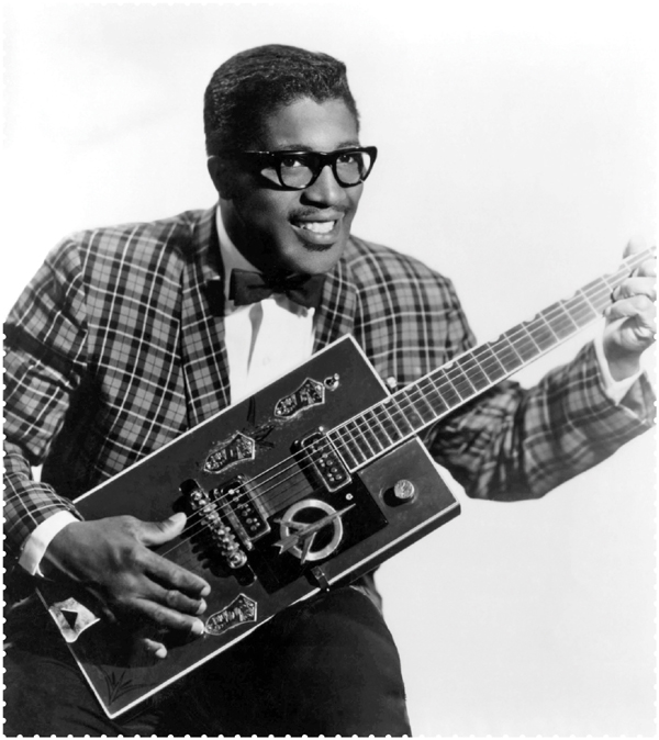 Image Credit Everett Collection Bo Diddley and his distinctive guitar in the - photo 3