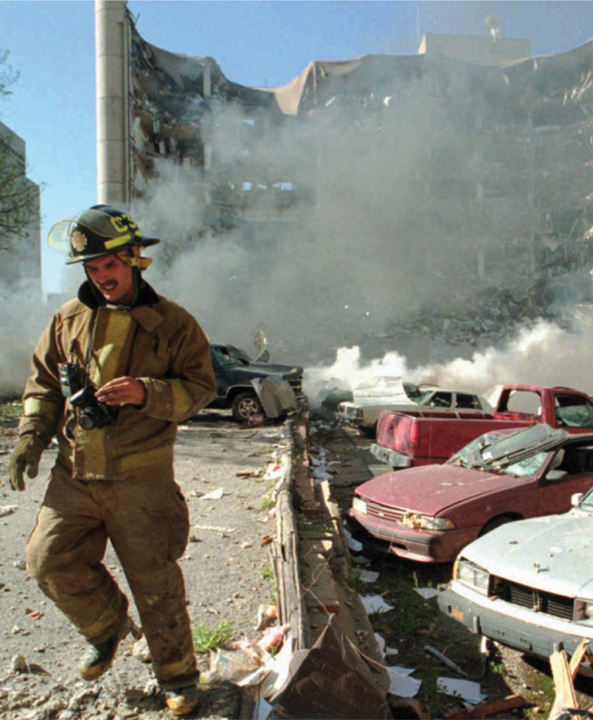 Image Credit AP Images The Daily Oklahoman Jim Argo A firefighter walks by - photo 2