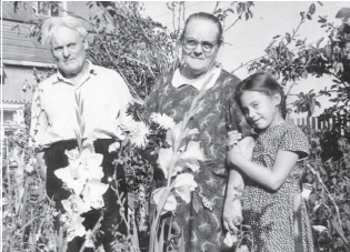 With my grandmother and grandfather at the dacha 1964 Lunch in our dacha - photo 7