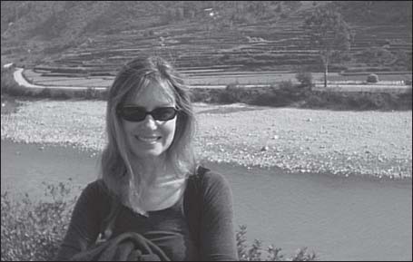 Lorie Karnath in Bhutan with rice paddies across the river Courtesy of Lorie - photo 6