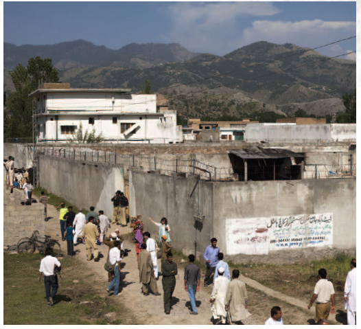 People walked past the compound where Osama bin Laden was killed by Team 6 - photo 1