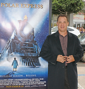 Image Credit AP PhotoTammie Arroyo Tom Hanks stands next to a poster for the - photo 5