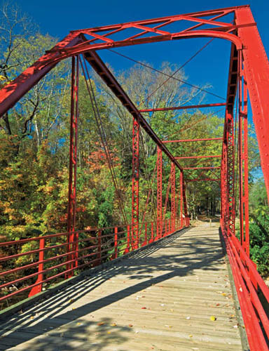 The 1910 Old Red Bridge crosses Spring Creek in Hot Springs Lichen-covered - photo 11