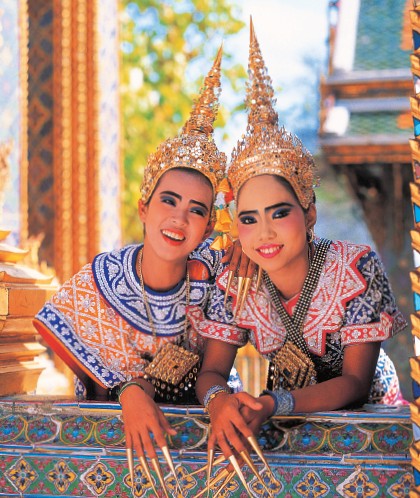 Thai dancers wearing lep yao or long fingernails display the smiles for which - photo 4