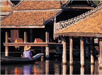 Traditional stilt house above the waters of the Chao Phraya River - photo 5