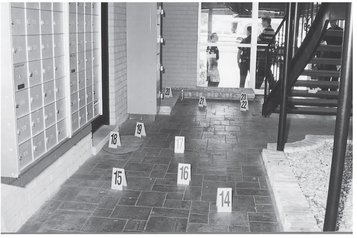 Bullet casings litter the walkway at The Crossings Courtesy of the Tampa - photo 19