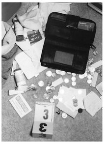 Contents from Jennifers purse were scattered on the bedroom floor Photo - photo 12