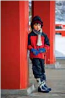 A winter scene of a young boy at the main hall of Kuramadera Temple in the - photo 9