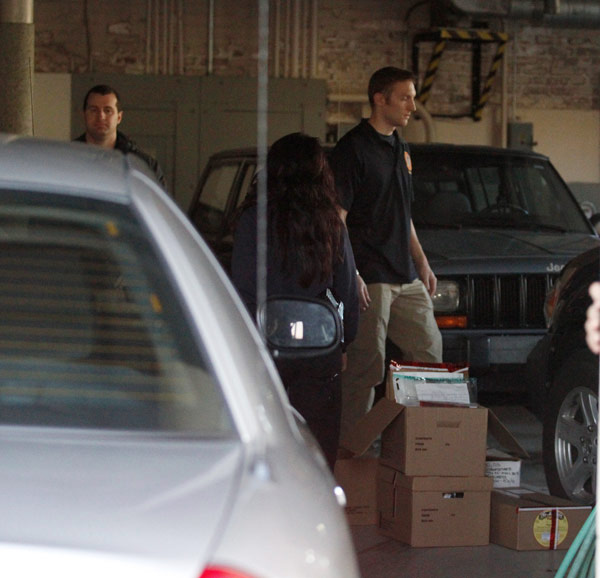 FBI agents wait to load boxes of evidence into their cars at the Dixon City - photo 4