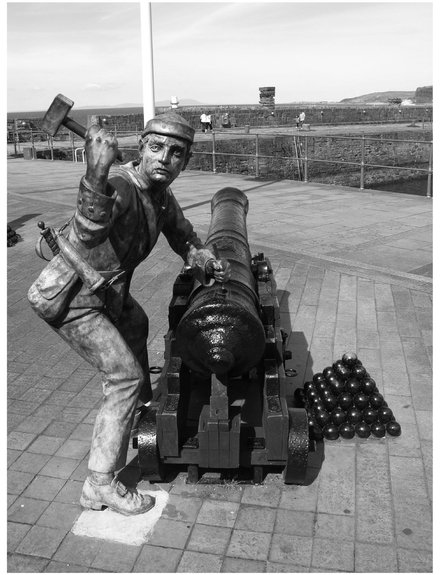 A modern day statue showing one of John Paul Joness men spiking the guns at - photo 3