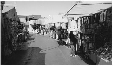 Rebecca sold bottled spices from a stall on a gaudy vendor lane like this one - photo 11