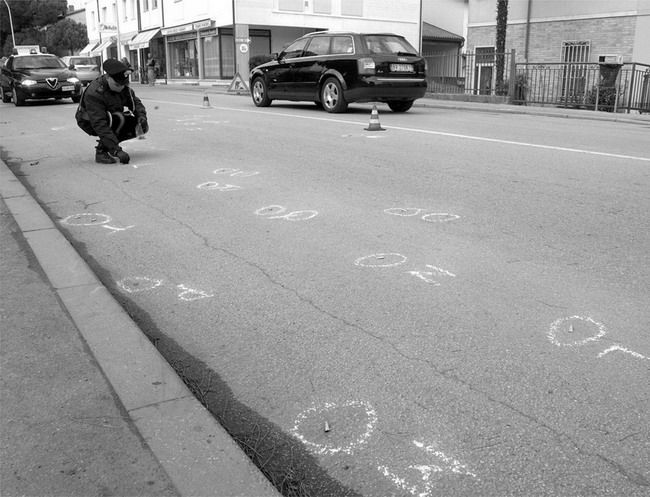 Chalk markings on the road record the location of bullet casings MODERN - photo 4