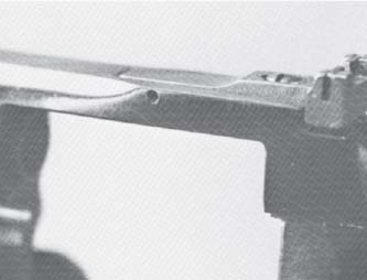 The rear sight is related by a cross-pin at the top of 1he frame and by its - photo 21