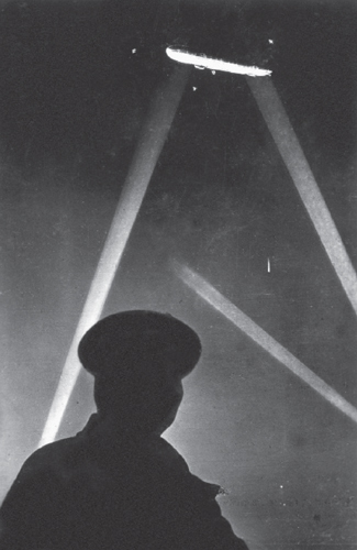 Zeppelin caught in the searchlights during a raid on London 1915 Zeppelin - photo 2