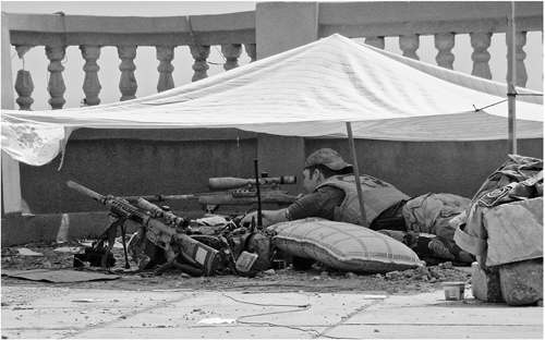 Set up on a roof in Ramadi The tent provided me a bit of relief from the sun - photo 16