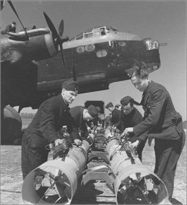 16 RAF ground crew prepare bombs before loading them into a Stirling bomber - photo 22