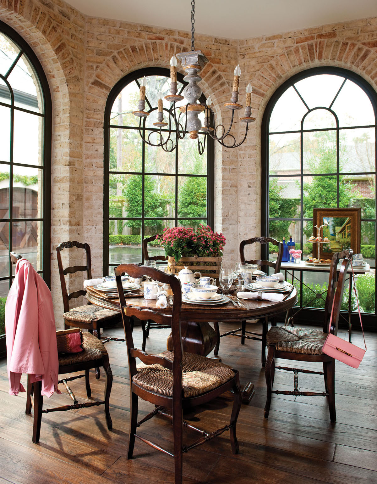 Carved chairs with cabriole legs and rush seats surround a pedestal table at - photo 3