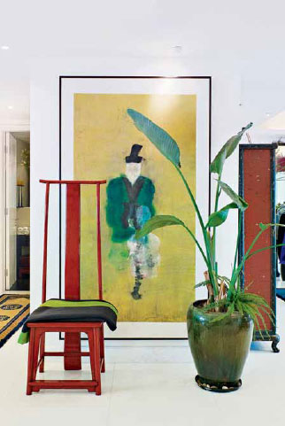 A geometric arrangement of painting furniture and plant makes use of the - photo 1