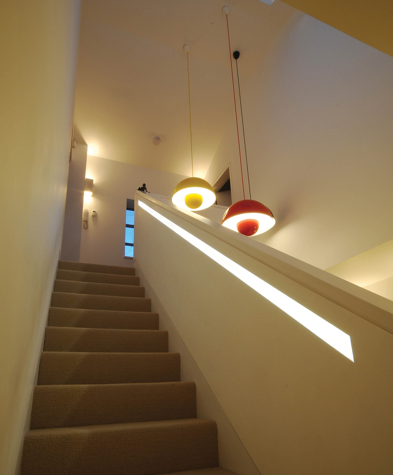 LED strip set into a recess under the handrail illuminates the stairs while - photo 4