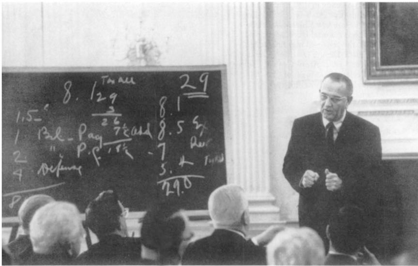 19 LBJ at his blackboard in August 1967 setting forth the case for his tax - photo 21