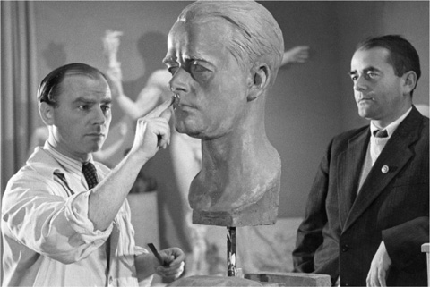 15 Arno Breker in 1940 models a portrait bust of Speer in his Berlin studio - photo 17