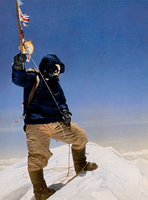 SUCCESS TENZING NORGAY holds out his ice ax into the thin air on the summit - photo 4