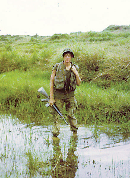 A Marine returns from patrol in the bush Troops often ditched their helmets - photo 6