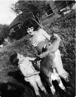Here I am with my younger sister and one of the calves on our family farm - photo 8