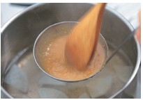 Stir the miso and dashi stock with a wooden spoon until the miso is well - photo 6