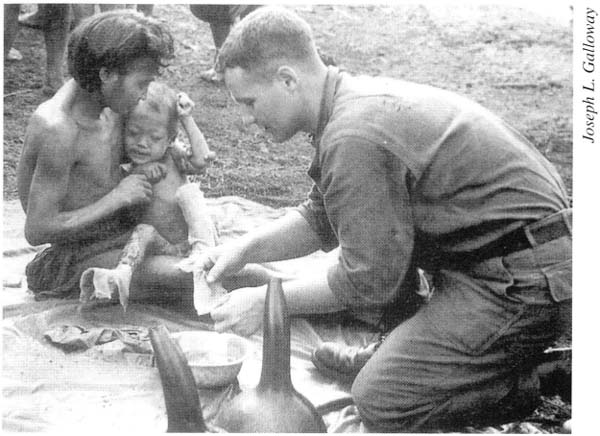 Doc Carrara treats a sick Montagnard child in an isolated village five miles - photo 10