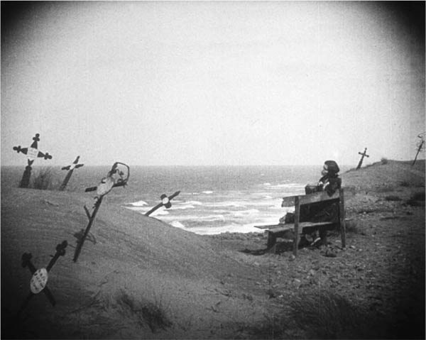 Mourning the dead Ellen sits among crosses at the sea from Nosferatu Shell - photo 1