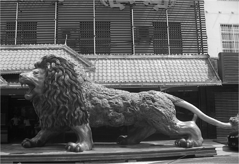 14 Where Burmas famous teak goes a gargantuan lion for sale in Ruili over the - photo 16