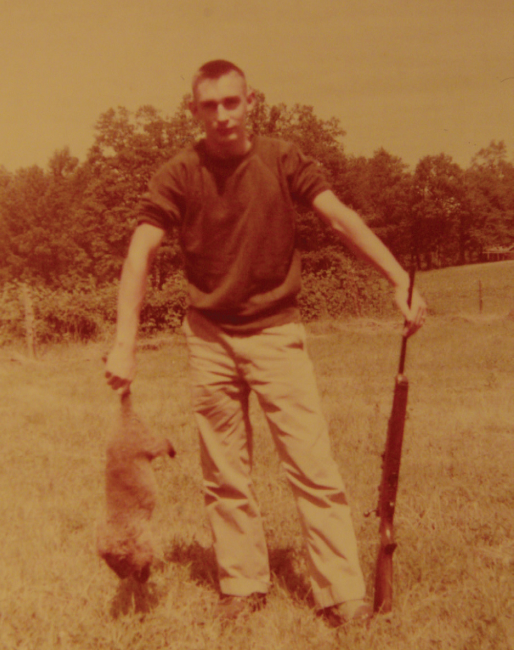 A 1952 photo of the author with his Model 43 Winchester and a pasture poodle - photo 3