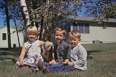 Dusty with my brothers and me circa 1968 When the little girl across the - photo 4