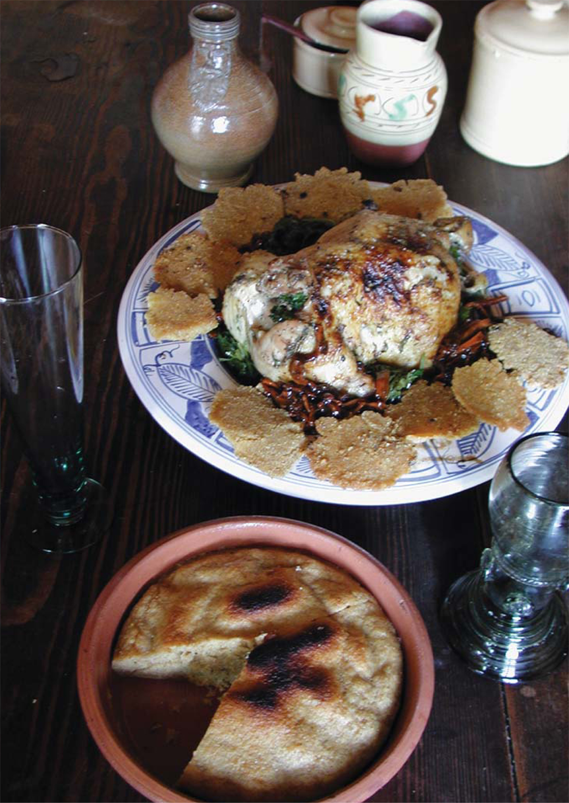 On a bed of stewed greens roast chicken blanketed with gravy takes center - photo 4