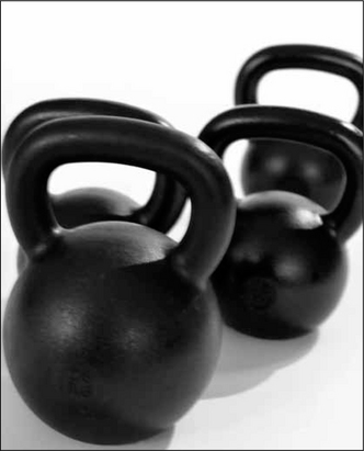 A kettlebell is a round cast iron or steel weight that resembles a cannon ball - photo 7