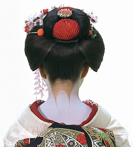 Kanzashi are most commonly seen adorning the hair of geisha and their - photo 11