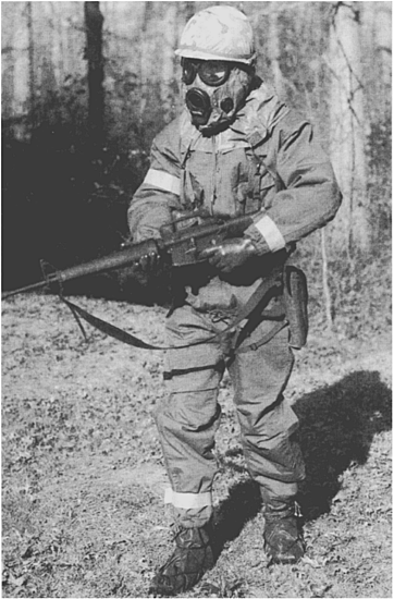 The 1980s combat soldier wore a Chemical Protective Overgarment with M9 - photo 2