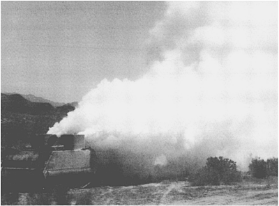 M1059 mechanized smoke generator system lays down a dense white screen at the - photo 12